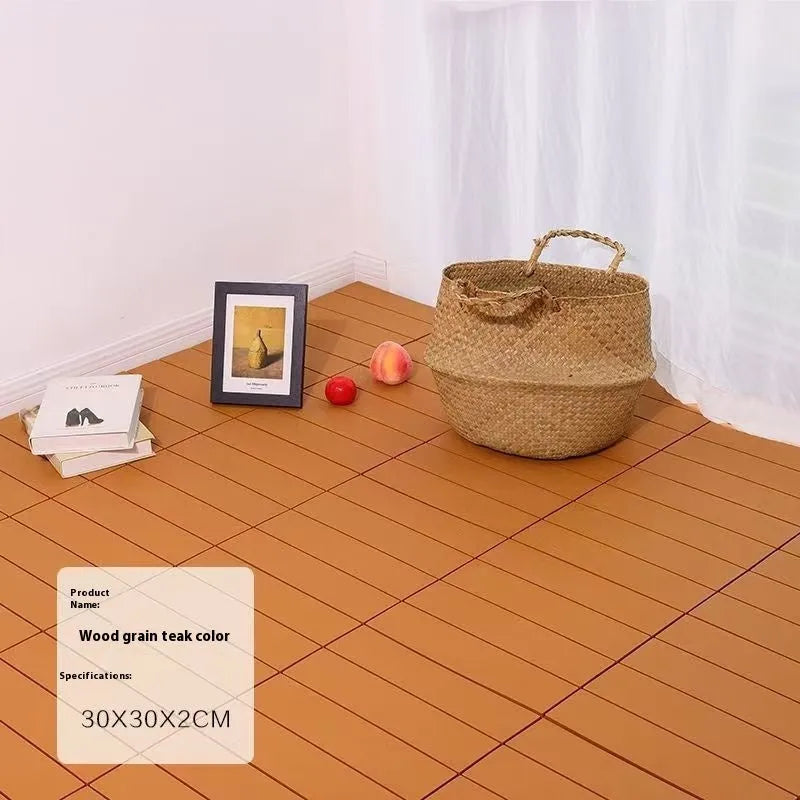 Square plastic floor tile with wood grain texture in a dark grey colour, shown on a light background.