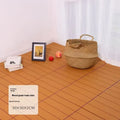 Square plastic floor tile with wood grain texture in a dark grey colour, shown on a light background.