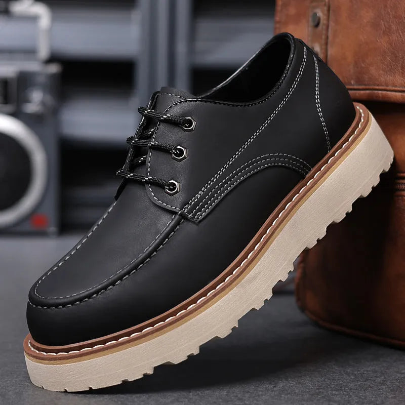 Men's black retro-style Martin boots with a round toe and mid-height rubber sole.