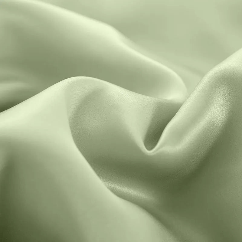 Solid colour double-sided silk duvet cover in bright brown, showing smooth texture and neat corner.