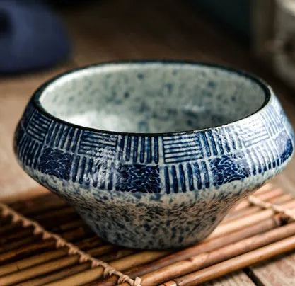 Porcelain Japanese soup bowl in stone conch shape with underglaze finish