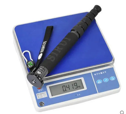 Black carbon fibre six-section telescopic camera monopod shown collapsed and extended.