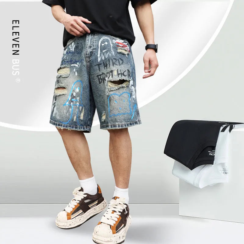 Blue ripped denim jeans shorts for men with graffiti design and straight leg opening.