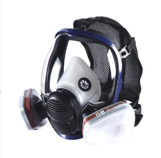 Blue edge spherical full face gas mask with trapezoidal canister on a grey background.