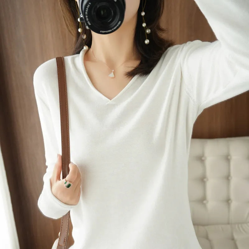 Women's long sleeve V-neck knitwear pullover top in a choice of ten colours on a hanger.