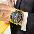 Men's automatic mechanical watch with stainless steel case on wrist, showing multi-functional dial.