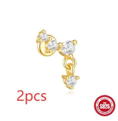S925 sterling silver geometric star earrings with embedded moon and diamond detail in a gold colour.