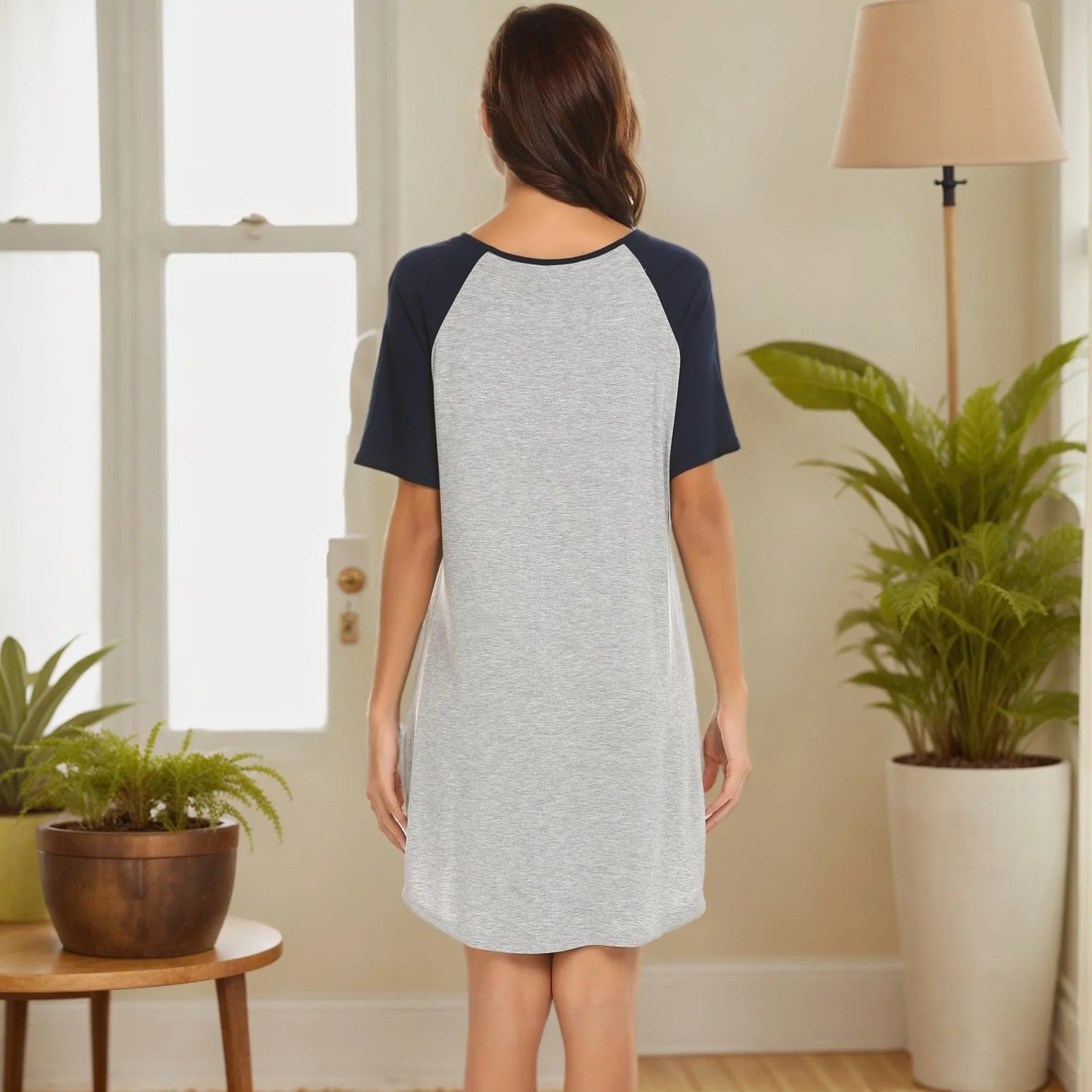 Women's sleeveless nightdress with colour block patchwork design on a hanger.
