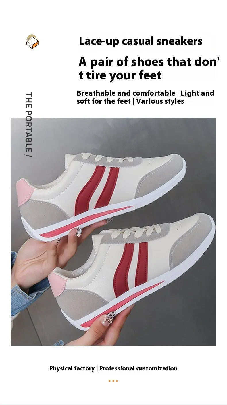 Red and blue lace-up running sneakers with soft rubber sole and mesh upper on white background