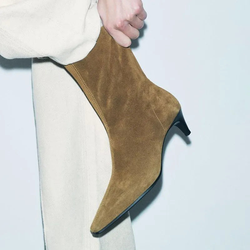 Brown square toe mid calf boots with a kitten heel and side zipper on a white background.