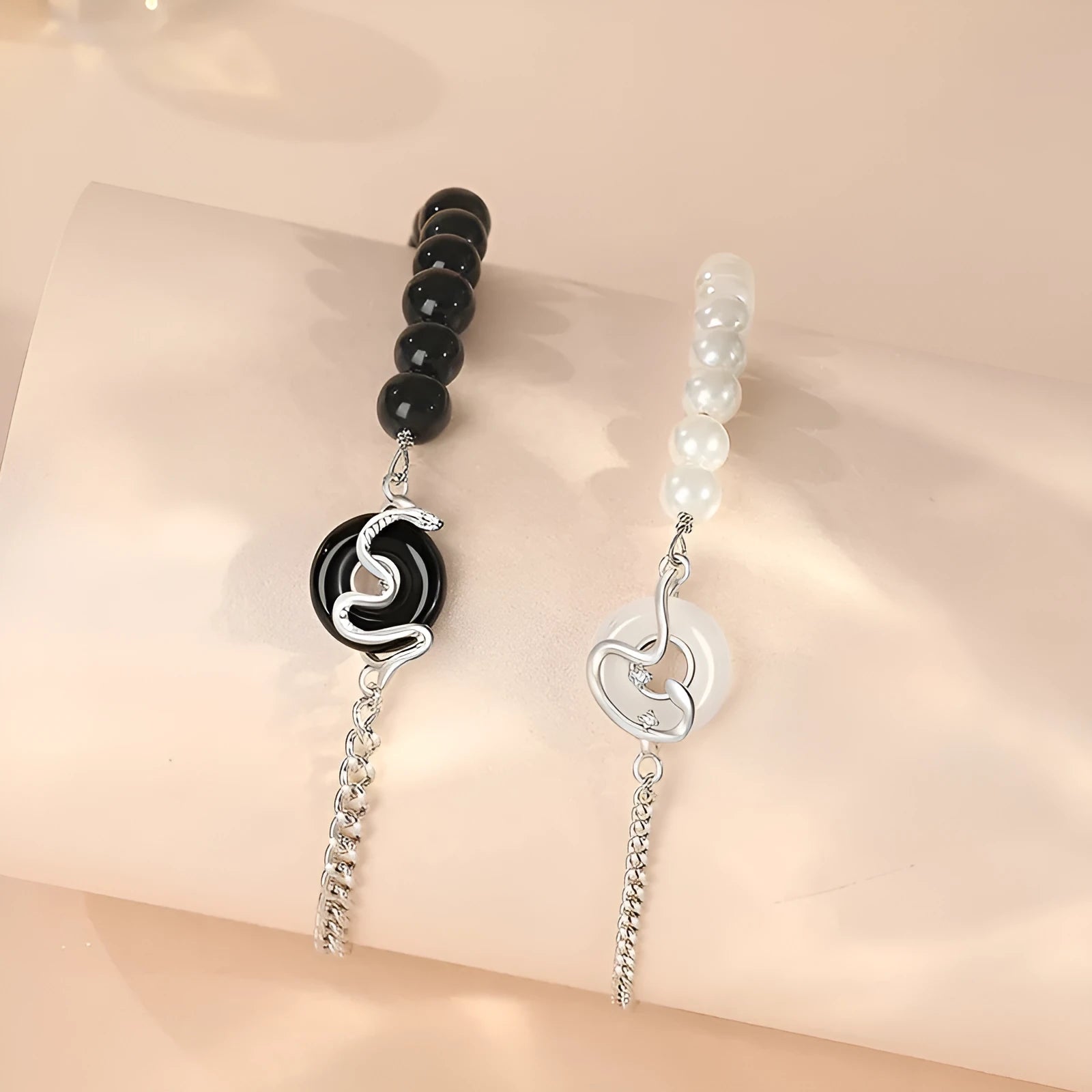 925 sterling silver couple bracelet with snake design and obsidian pearl accents on security buckle