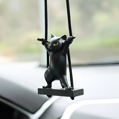 Cartoon style resin cat pendant on a rope for hanging in a car, shown in multiple colour options.