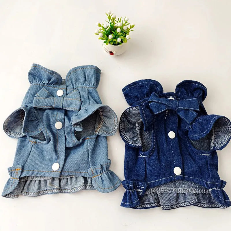 Blue denim dog dress with ruffles and integrated leash hooks on the chest and back.