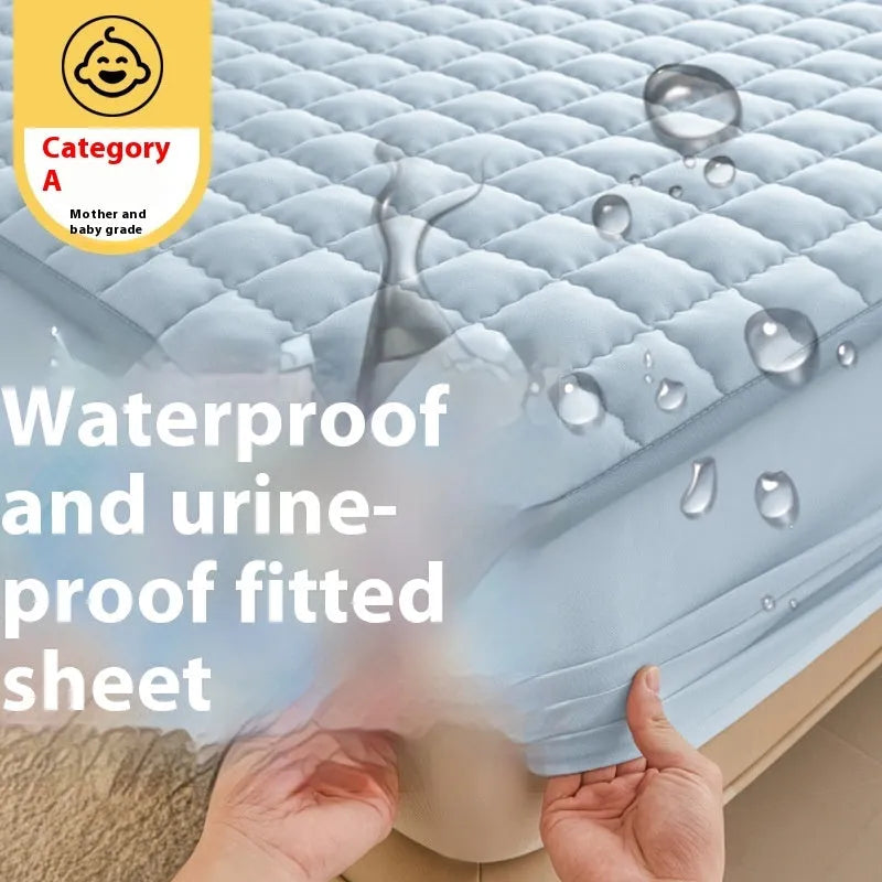 Class A waterproof fitted sheet in light grey colour, shown fitted neatly on a mattress.