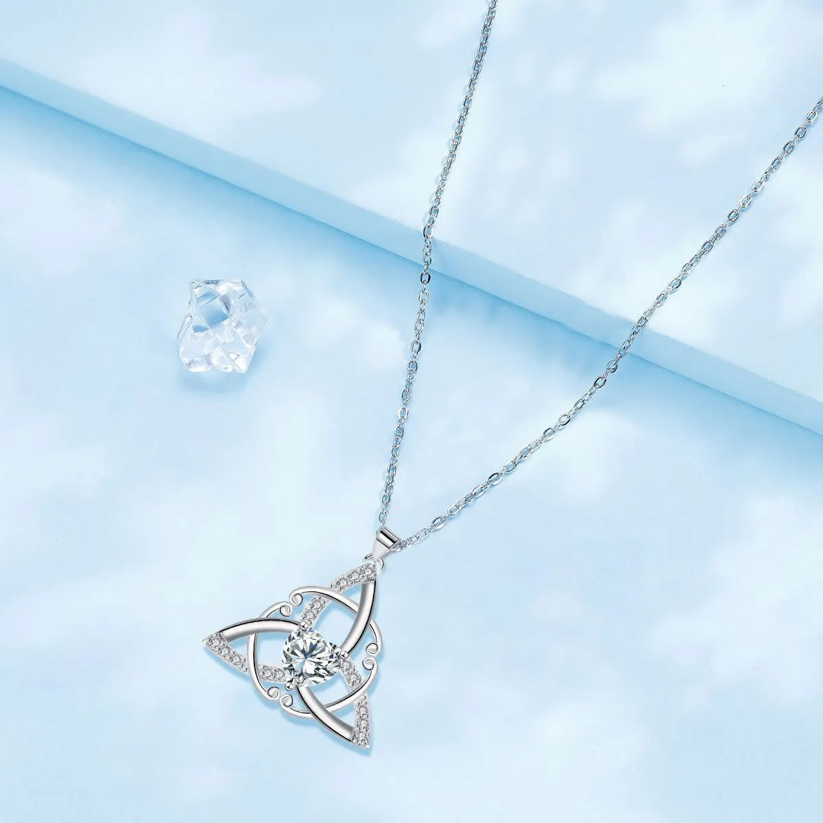 Copper Celtic knot necklace with geometric pendant in blue colour option, electroplated finish