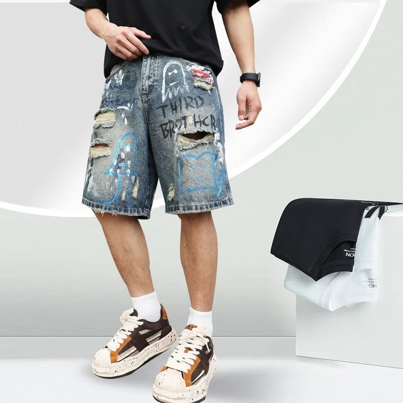 Blue ripped denim jeans shorts for men with graffiti design and straight leg opening.