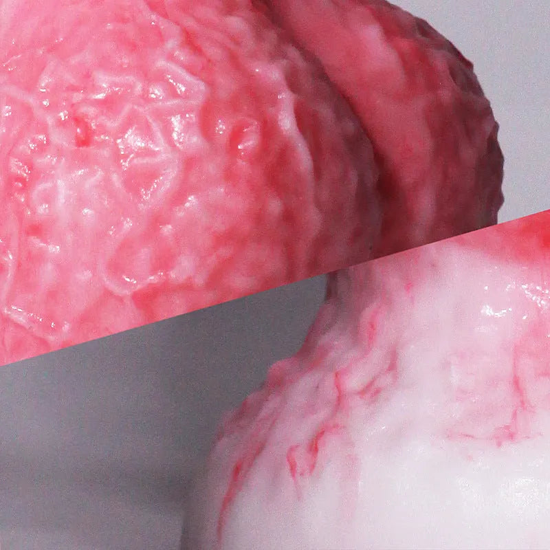 Pink platinum silicone women's masturbation device shaped like a penis