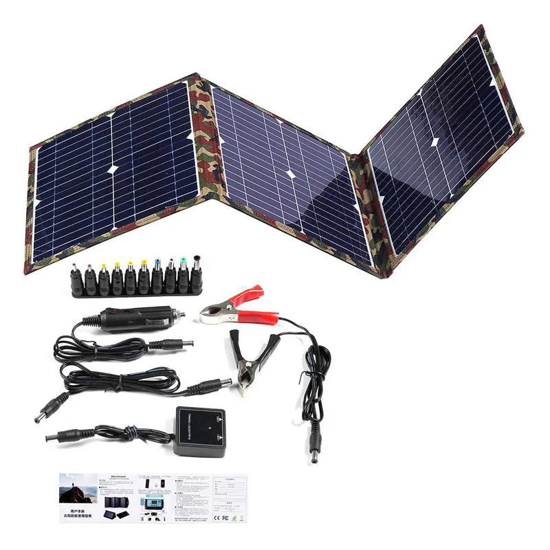 Black foldable solar panel unfolded showing three solar cells with car charger and USB accessories