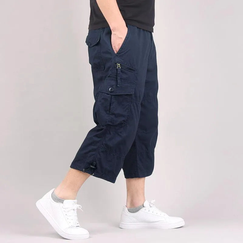 Man wearing loose khaki cotton cropped casual pants for sports.