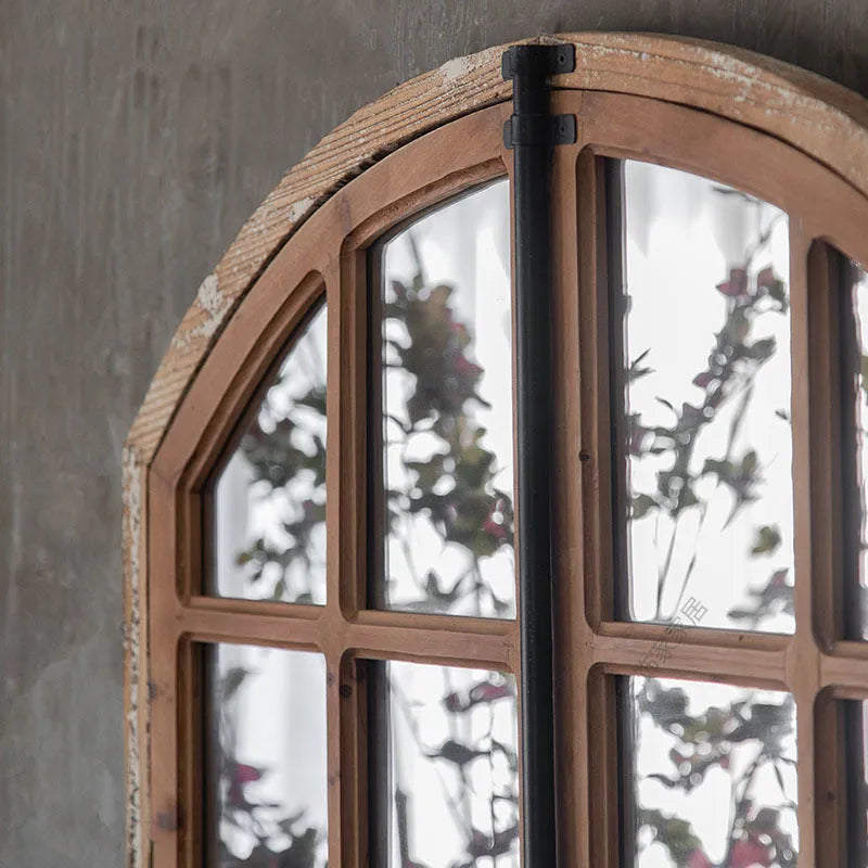 Terrace distressed wooden frame fake window wall mirror in log colour hanging on a wall.