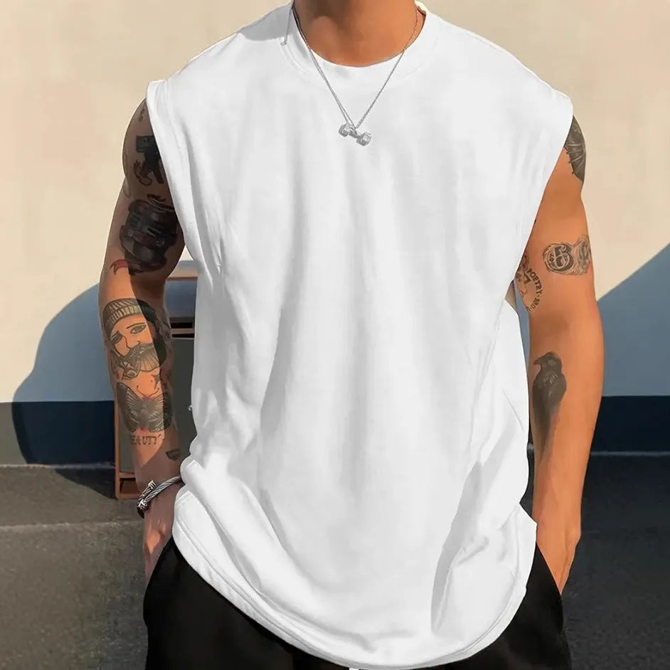 Men's loose cotton tank top in solid colours showing sleeveless design and straight hem