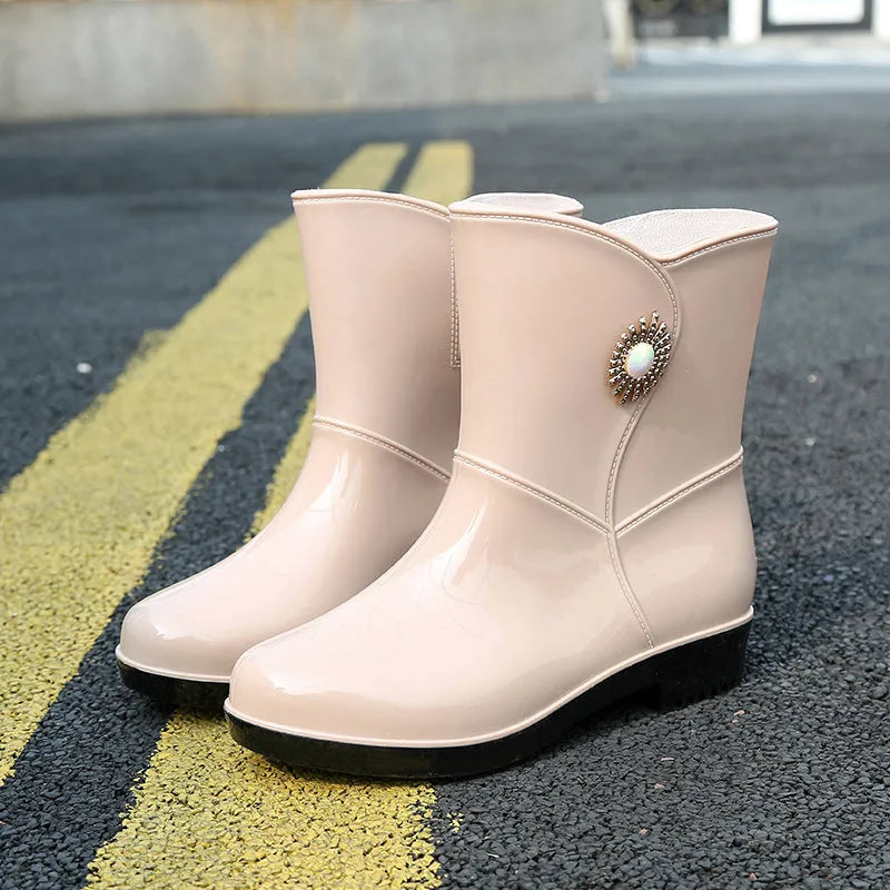 Women's purple PVC rain boots with non-slip sole and middle tube design