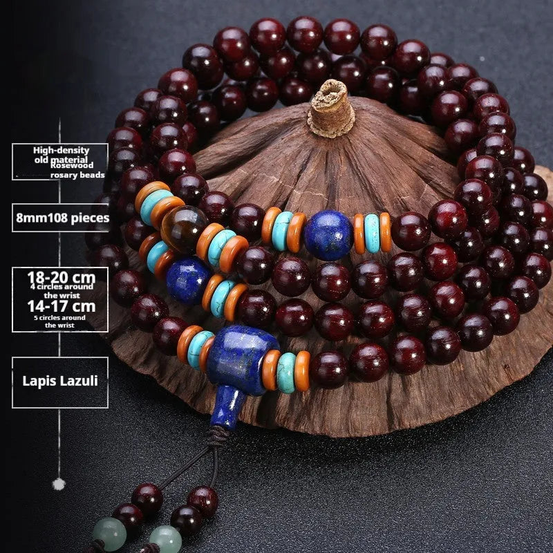 Men's rosewood 108 bead mala bracelet with a turquoise gemstone decorative centrepiece.