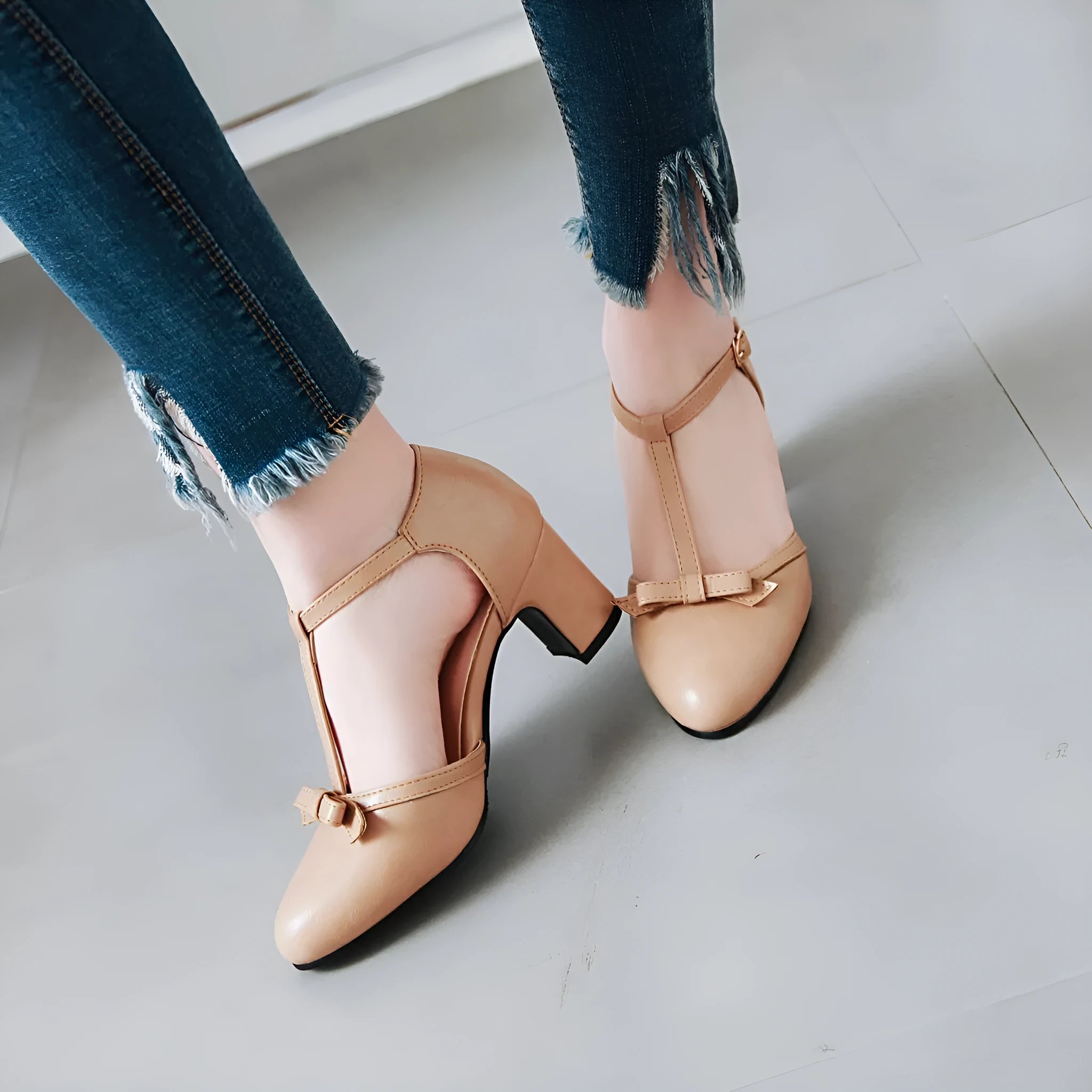 Women's apricot colour sandals with bow tie detail, chunky 6.5cm block heel, and adjustable buckle strap