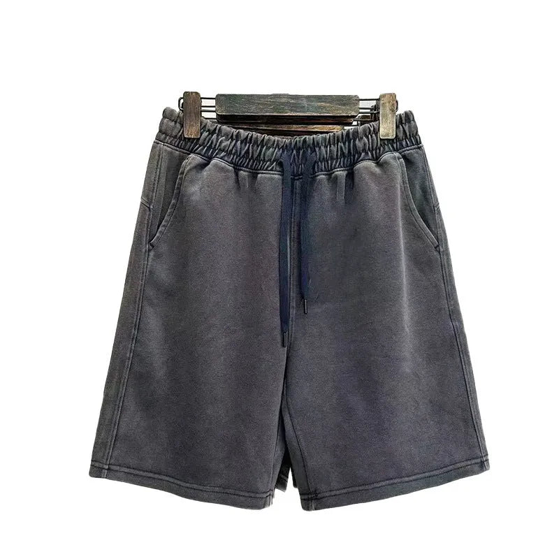 Men's cotton distressed shorts in loose fit straight-leg design