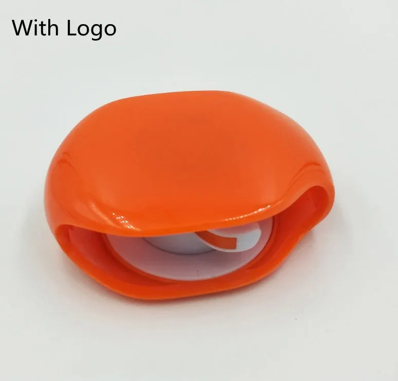 Automatic push-button earphone cable winder reel in assorted colours on a white background.