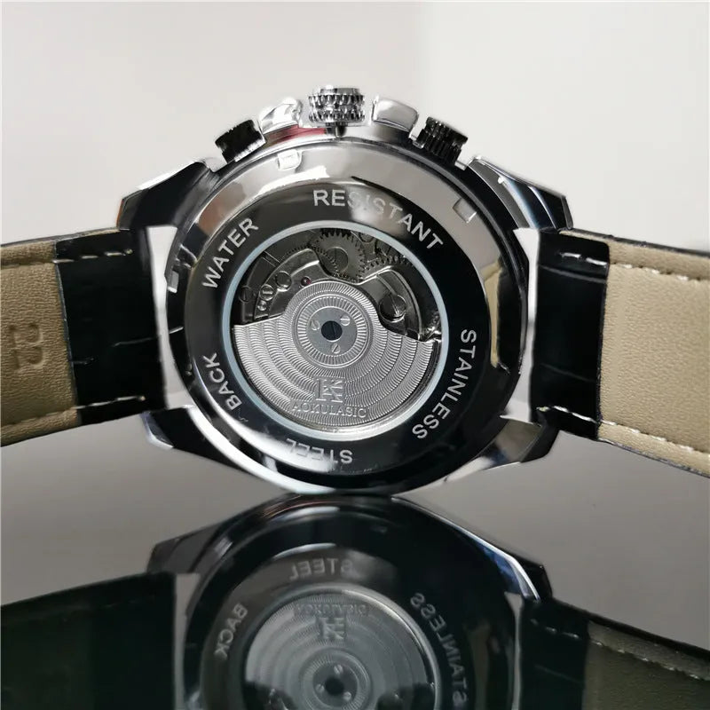 Men's automatic mechanical watch with stainless steel case on wrist, showing multi-functional dial.