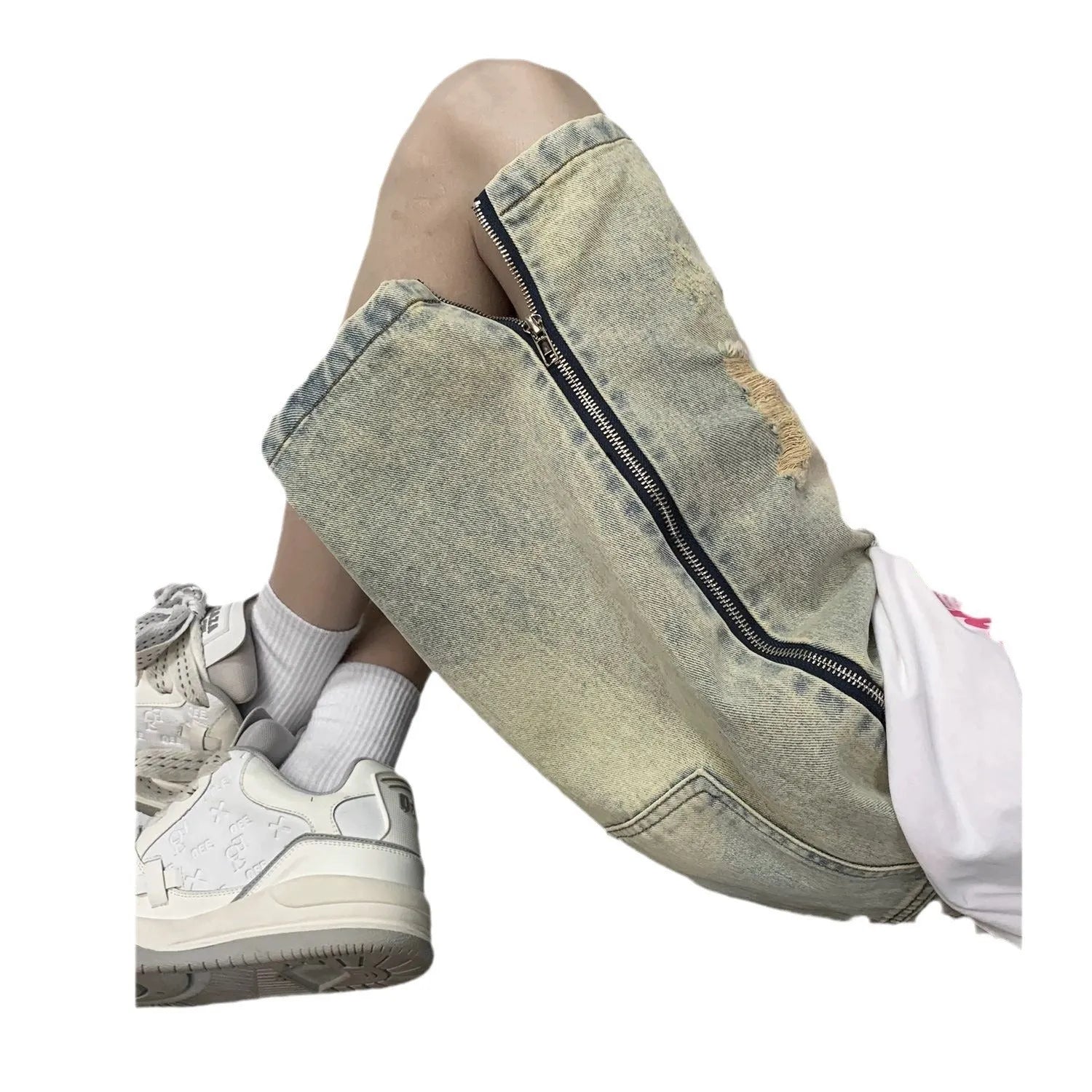Men's blue denim shorts with yellow mud wash effect, ripping details, button fly, and loose straight-leg fit