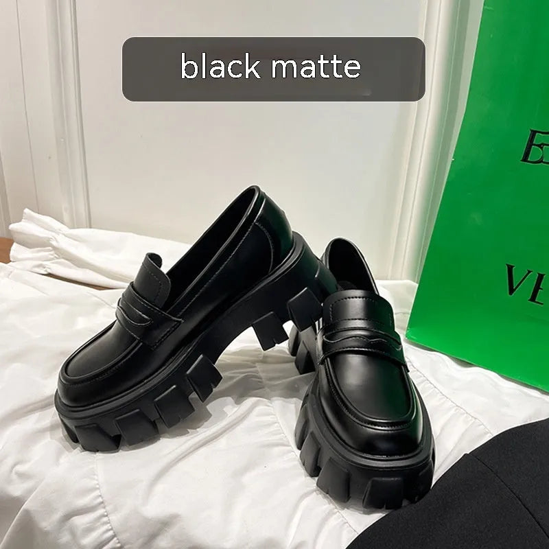 British style wide fit loafers in patent or matte leather with a rubber sole.