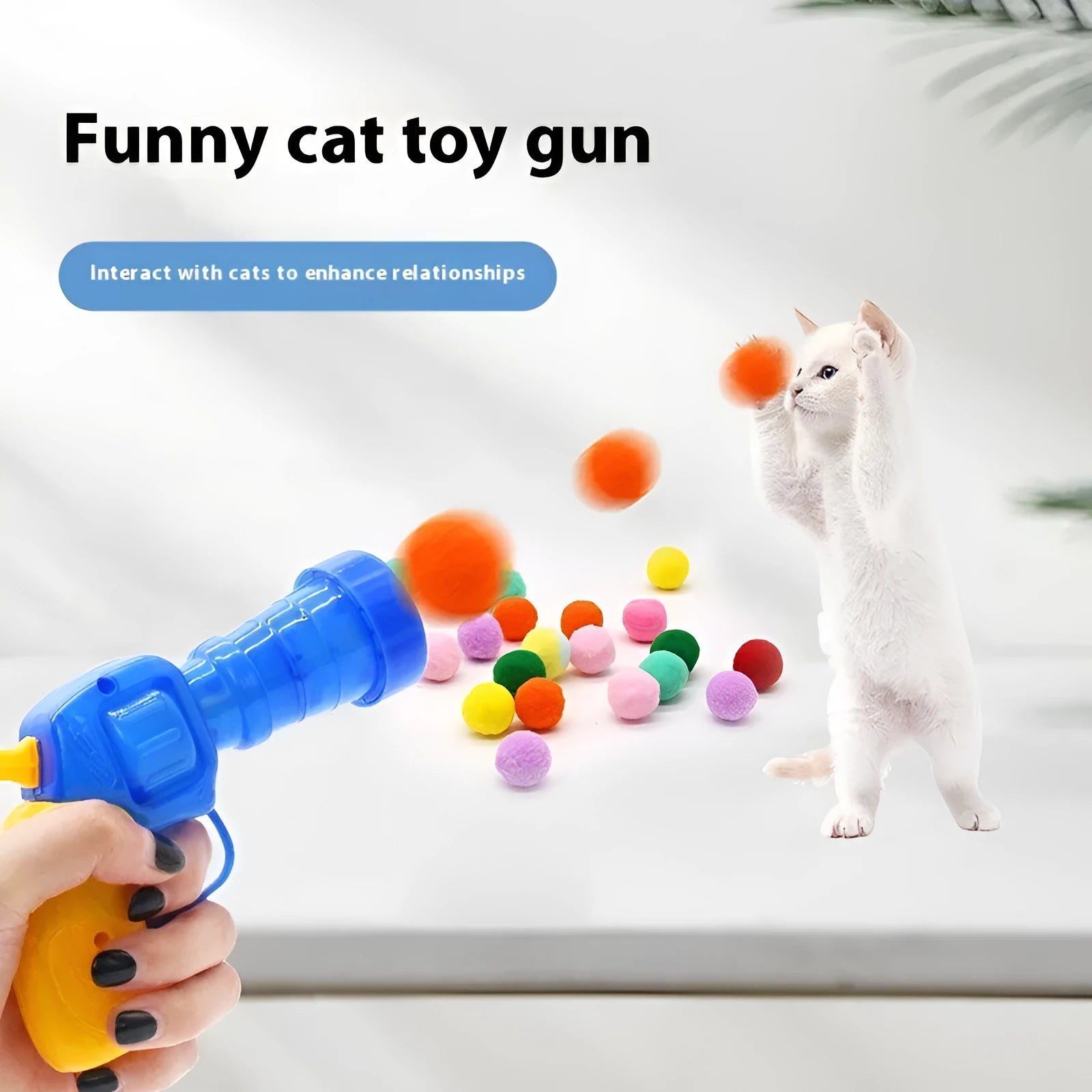 Interactive pet toy gun with plush balls for dogs and cats, showing launcher with 30cm barrel and multiple soft balls