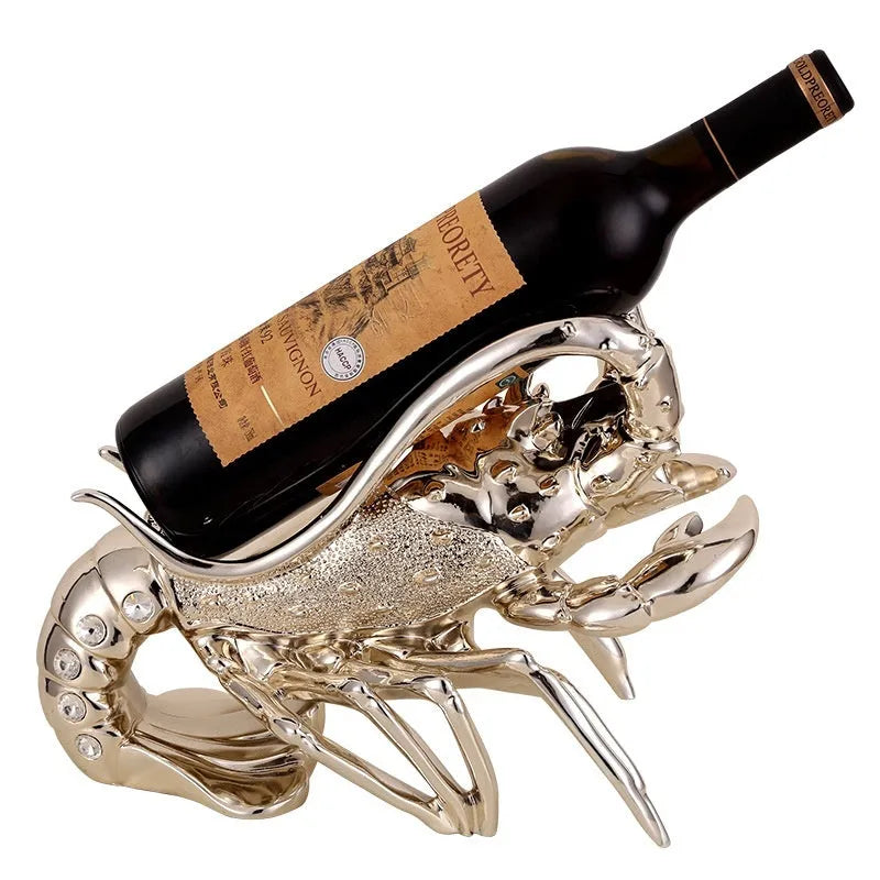 Lobster-shaped wine rack theme ornament in rose gold or silver resin and plastic finish on a shelf.