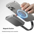 Grey magnetic mobile solid state drive with C to C cable and magnetic ring on a dark surface.