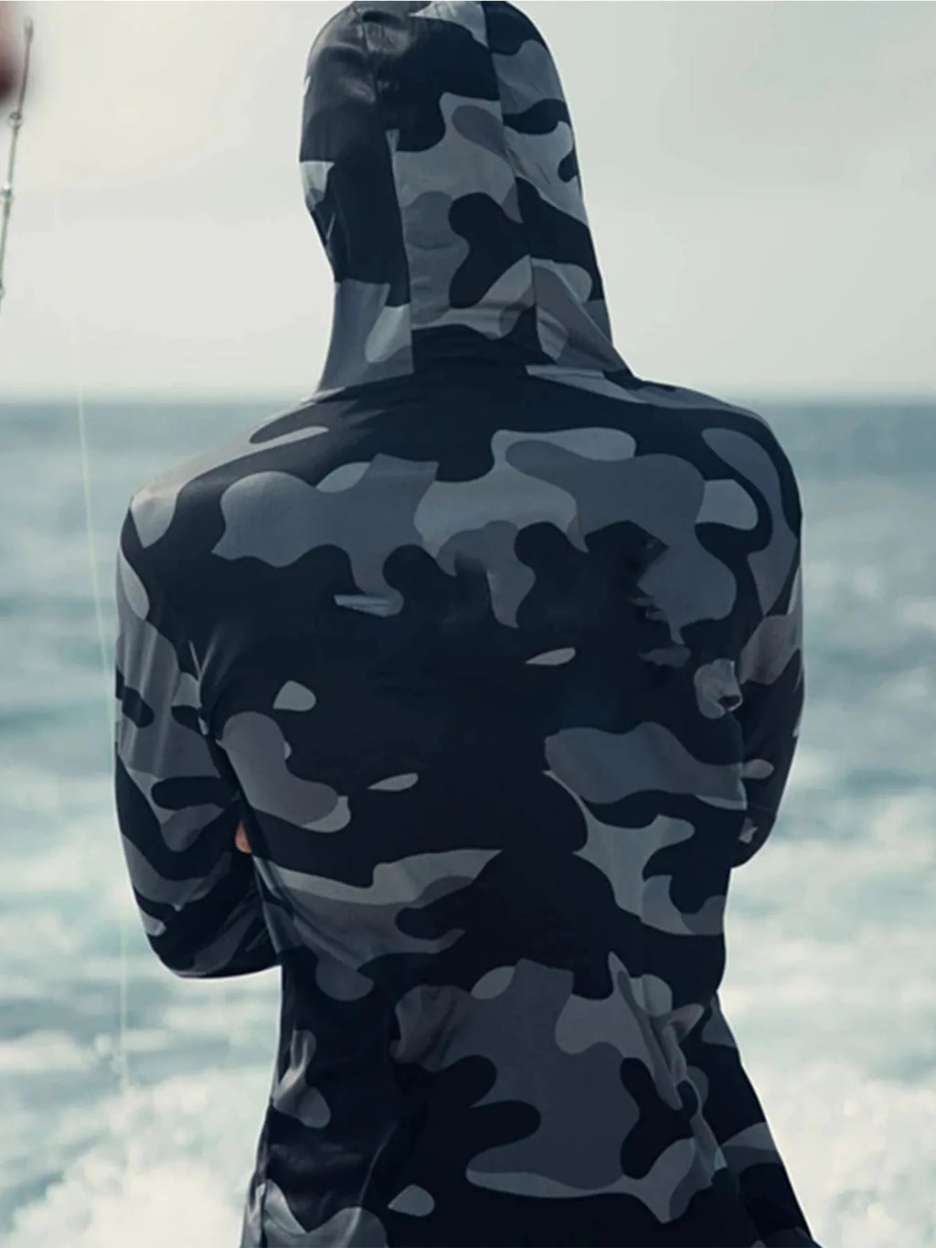 Huk Pursuit men's grey long sleeve fishing hoodie showing mesh side panels and crew neck.