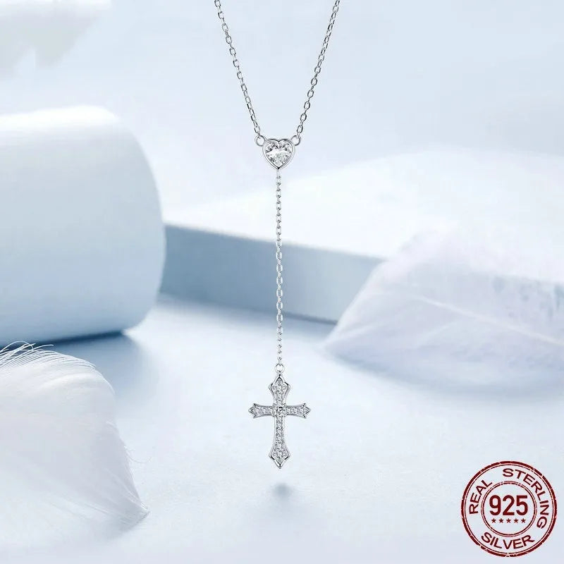 Simple sterling silver V-neck cross pendant necklace on an O-ring chain, colour BSN384.