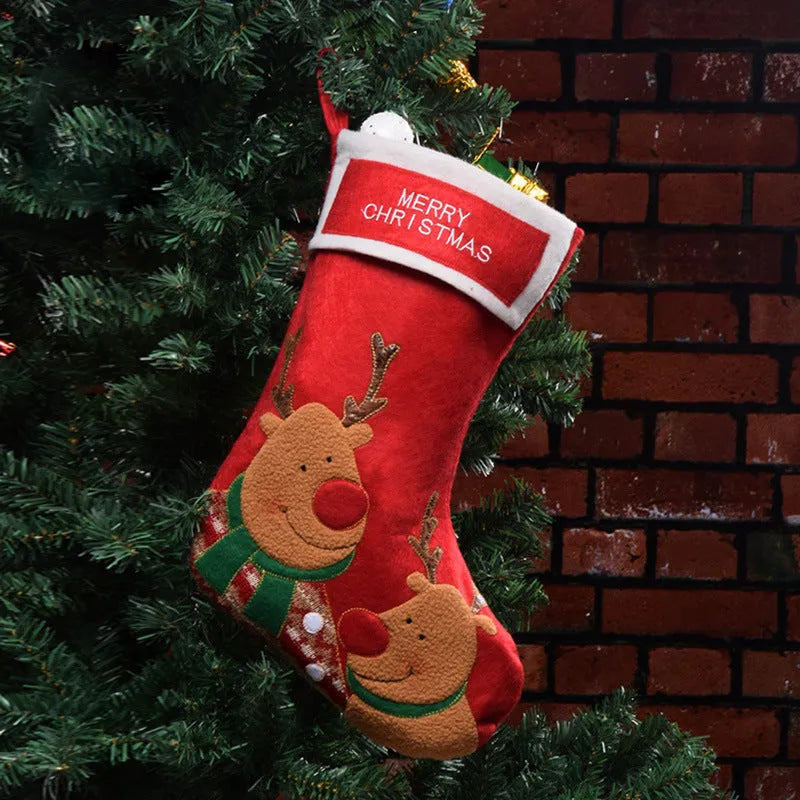 Christmas sock pendant decorations showing elk, Santa, and snowman motifs