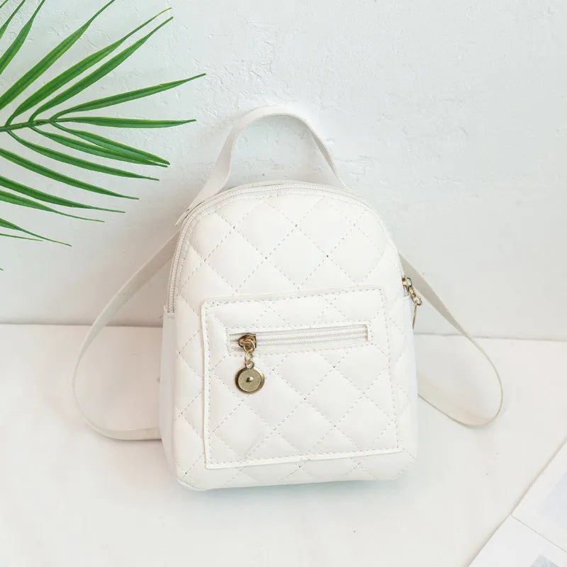 Girls' Korean style embroidered backpack in hard PU material showing vertical square shape and sandwich pocket