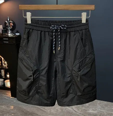 Men's camouflage cargo shorts with cargo pockets and loose fit design in cotton blend fabric