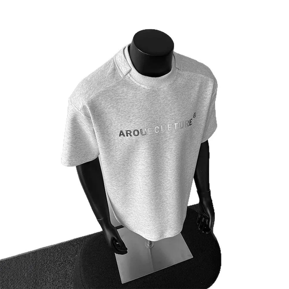 Men's white short sleeve cotton t-shirt with printed letters showing loose fit pullover style