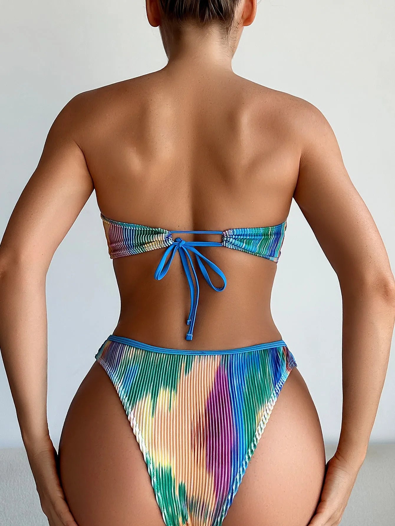 Color printed polyester tube top bikini set with matching briefs for swimming.