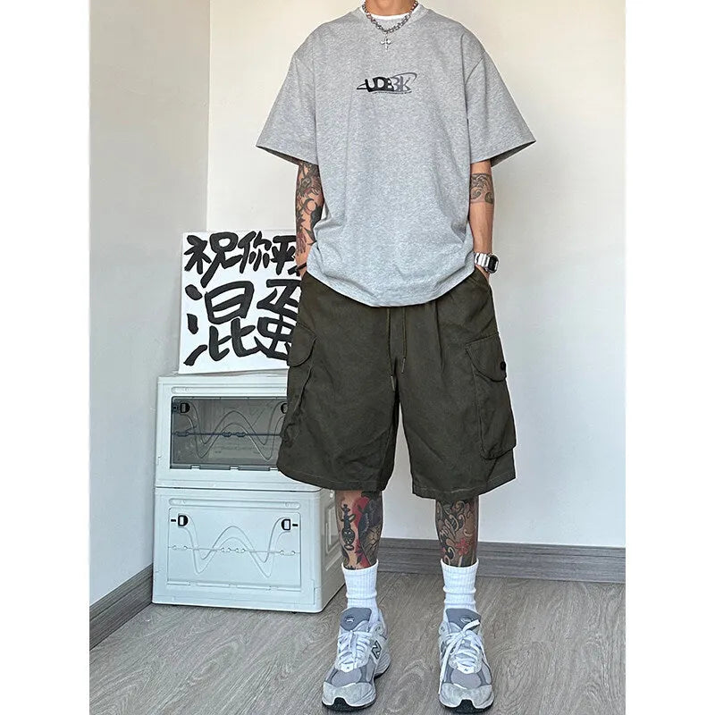 Man wearing straight-leg casual shorts in khaki colour, showing the relaxed fit and shorts length