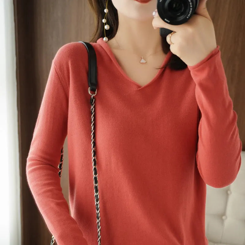 Women's long sleeve V-neck knitwear pullover top in a choice of ten colours on a hanger.