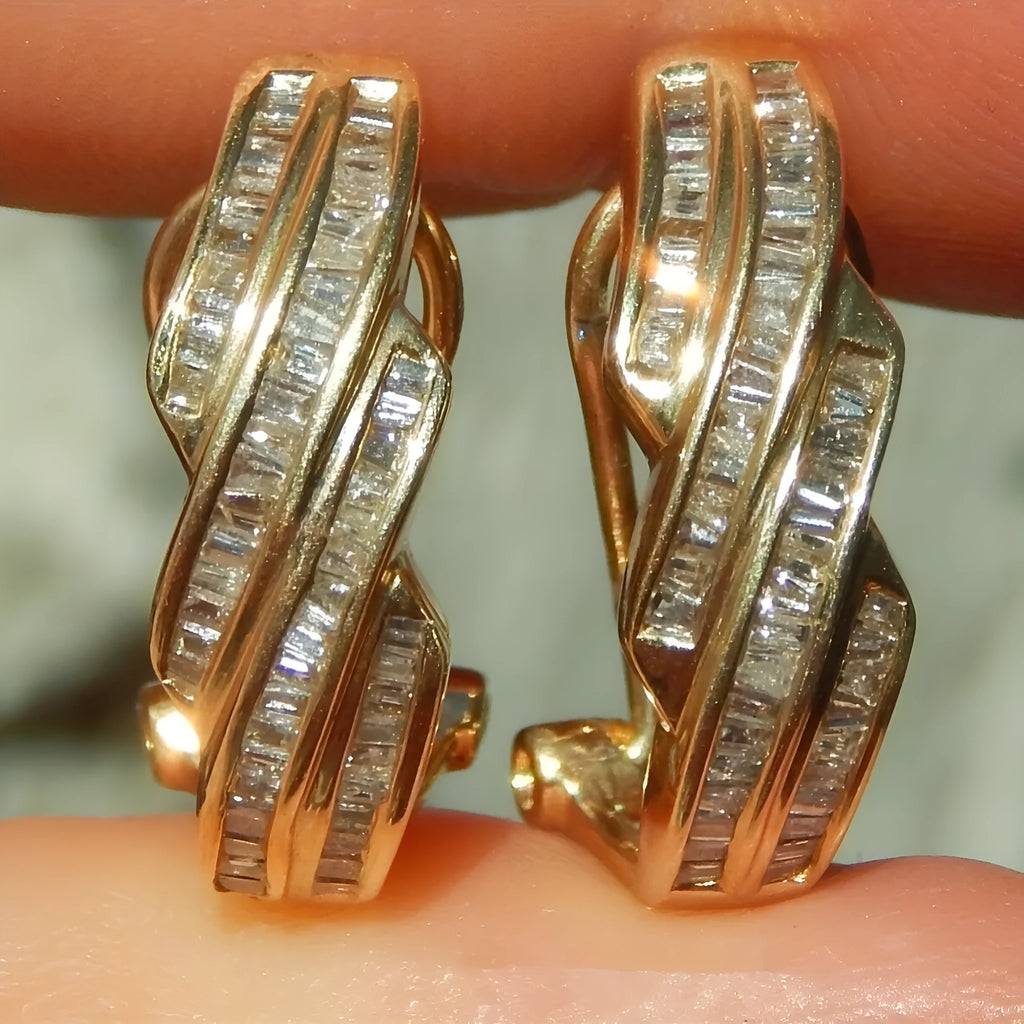 Gold geometric copper hoop earrings with circular retro elements on white background