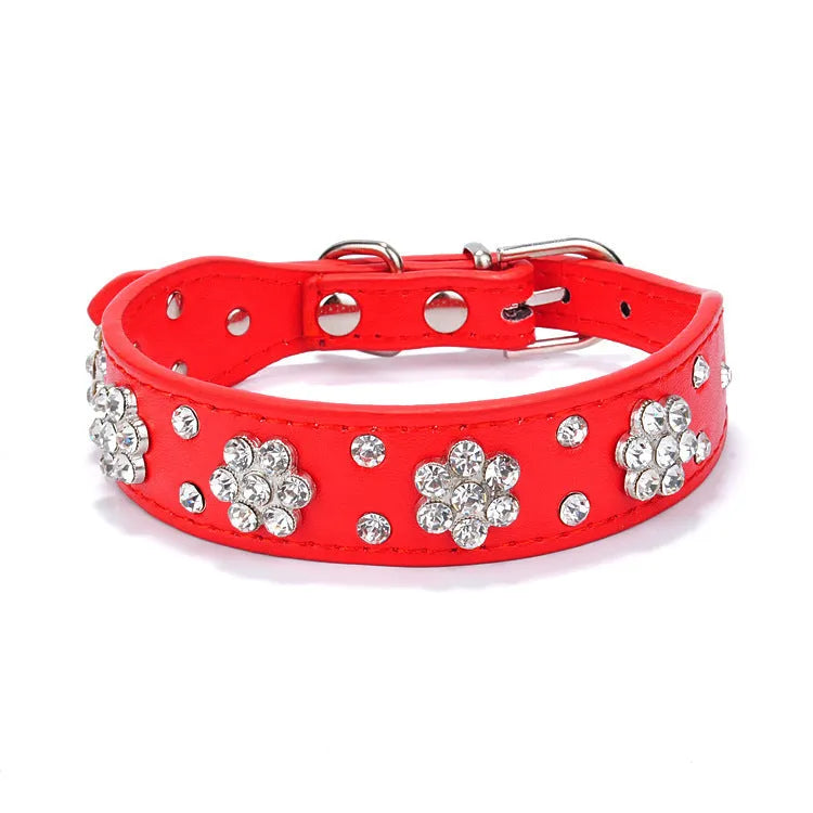 Black PU leather dog collar with rhinestone flowers and metal studs, showing the adjustable eyelets and D-ring.