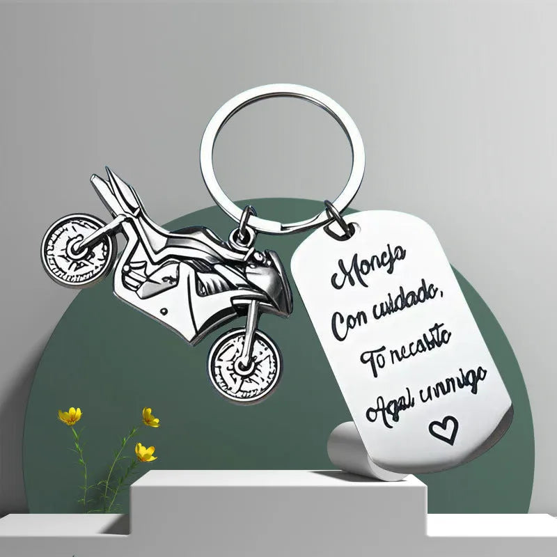 Stainless steel motorcycle keychain with velvet gift pouch in modern minimalist design