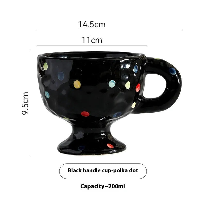 Hand-pinched irregular ceramic mug in a solid colour, showing unique handmade shape.