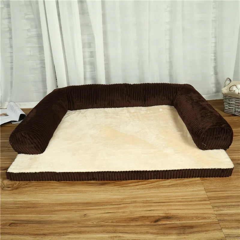 Corduroy dog bed sofa with bolster sides and non-slip base in a neutral colour.